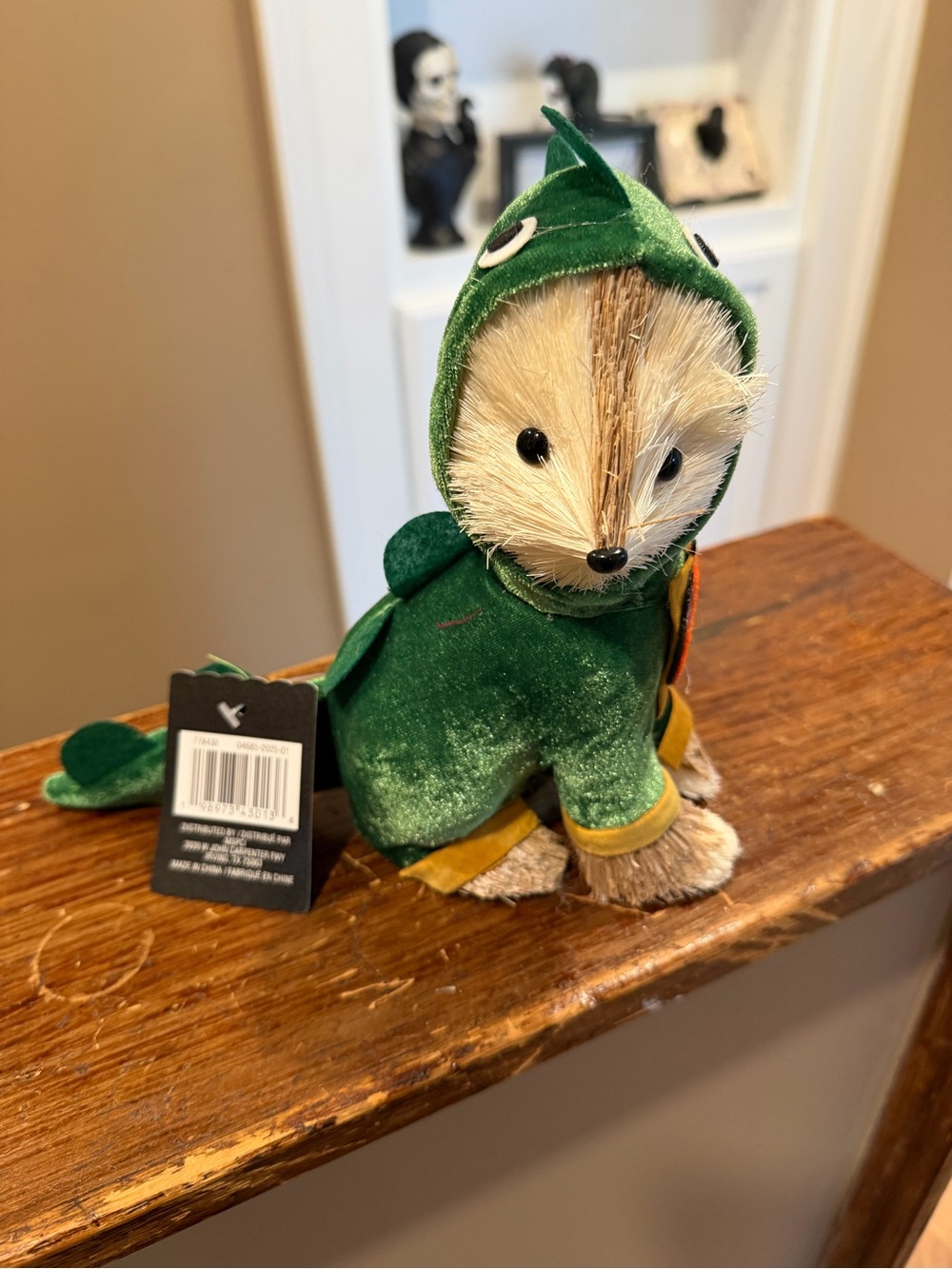 Cute Halloween decor animal dressed in dinosaur costume
